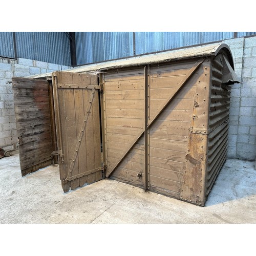 700 - A railway covered goods wagon, painted brown, approx. 17ft 6in long, 7ft 8in wide and 7ft 6in high (... 