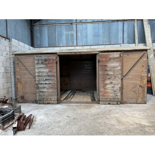 700 - A railway covered goods wagon, painted brown, approx. 17ft 6in long, 7ft 8in wide and 7ft 6in high (... 