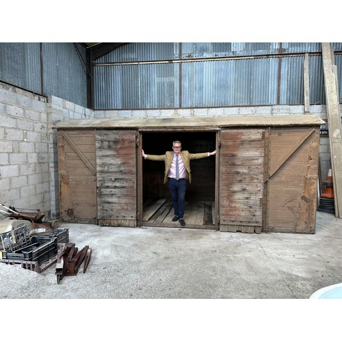 700 - A railway covered goods wagon, painted brown, approx. 17ft 6in long, 7ft 8in wide and 7ft 6in high (... 