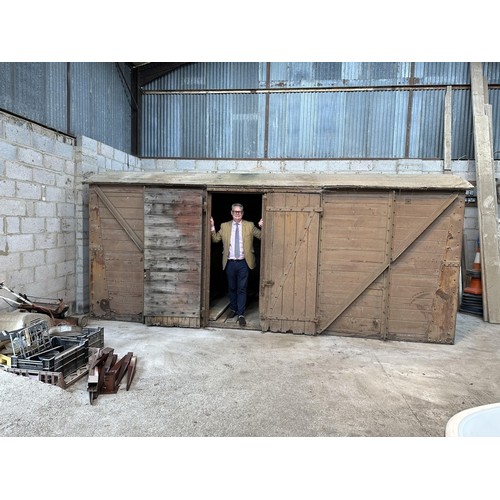 700 - A railway covered goods wagon, painted brown, approx. 17ft 6in long, 7ft 8in wide and 7ft 6in high (... 