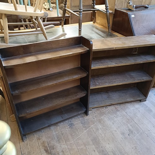 976 - A mahogany kneehole desk, having an eight drawer configuration, 150 cm wide, and two bookcases (3)