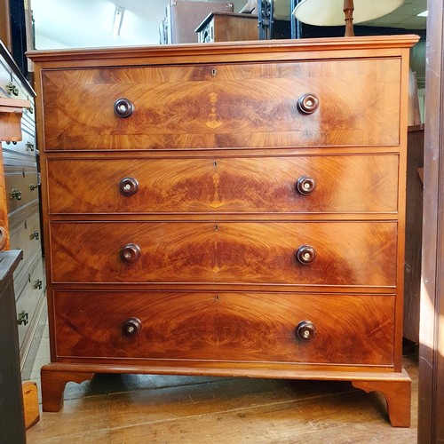 874 - A mahogany chest, having four drawers, 106 cm wide