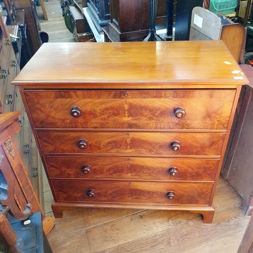 874 - A mahogany chest, having four drawers, 106 cm wide