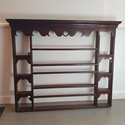 880 - An oak plate rack, 110 x 122 cm