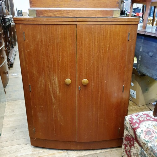 911 - A 1970's cocktail cabinet, 82 cm wide, a mahogany and brass bound box, a child's chair, a nest of oa... 