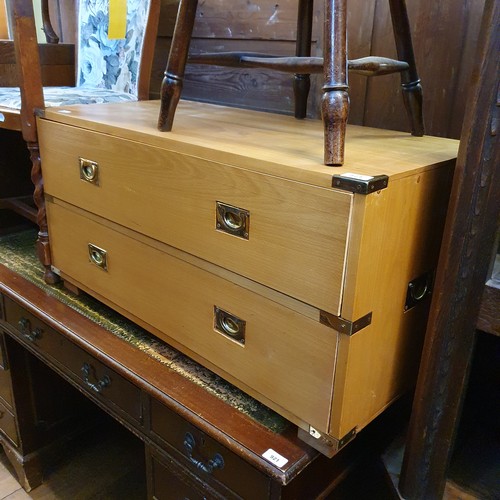 921 - A mahogany pedestal desk, 137 cm wide, a two drawer chest, and three chairs (5)