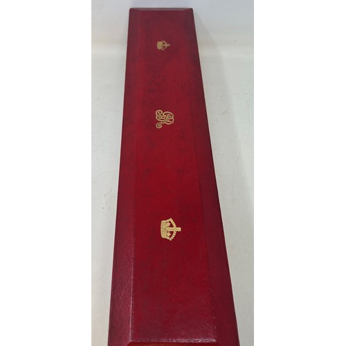 586 - A George V red leather scroll box, tooled and highlighted in gilt, with royal cypher, 50 cm wide