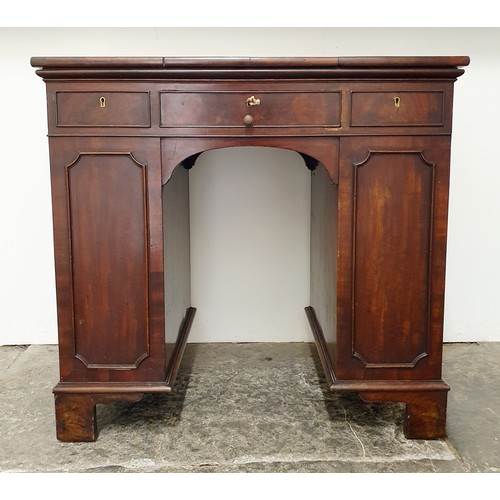 858 - An unusual mahogany kneehole desk, the top having three drawers, with cupboard doors to the side, 84... 