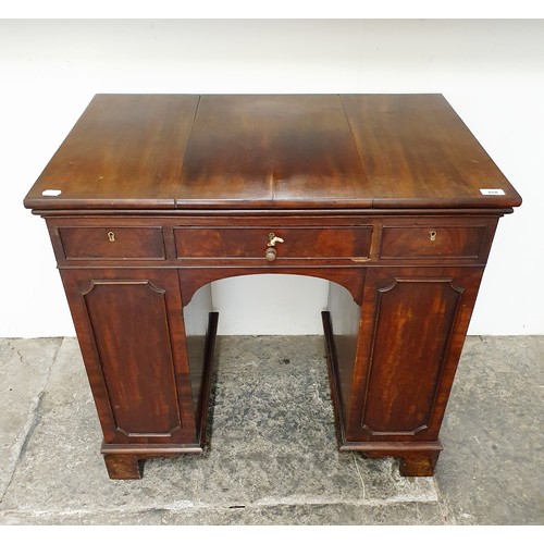 858 - An unusual mahogany kneehole desk, the top having three drawers, with cupboard doors to the side, 84... 