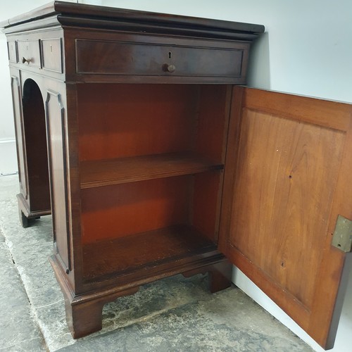 858 - An unusual mahogany kneehole desk, the top having three drawers, with cupboard doors to the side, 84... 