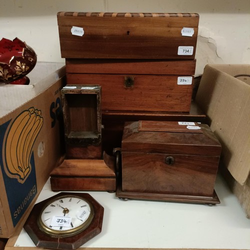 734 - A mahogany tea caddy, 23 cm wide, a clock and four boxes (6)