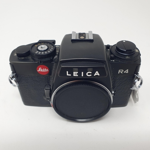 699 - A Leica R4 camera, No. 1609249, body only, and a manual