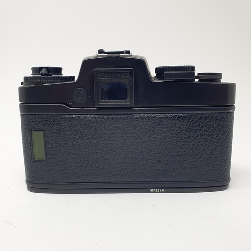 699 - A Leica R4 camera, No. 1609249, body only, and a manual