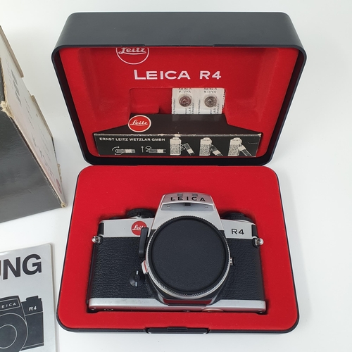 696 - A Leitz Leica R4 camera, boxed, No 1575566