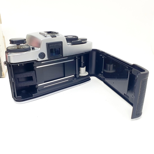 696 - A Leitz Leica R4 camera, boxed, No 1575566