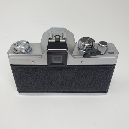 543 - A Leica pocket book, a Leica lens box, a box camera, in a vintage leather suitcase, a Leitz slide pr... 