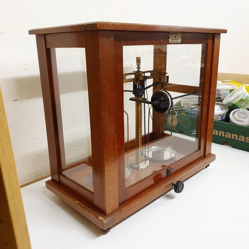 724 - *** Regretfully Withdrawn ****A set of laboratory scales, in a mahogany case, 45 cm wide, five other... 