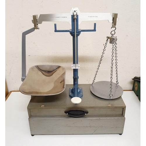 724 - *** Regretfully Withdrawn ****A set of laboratory scales, in a mahogany case, 45 cm wide, five other... 