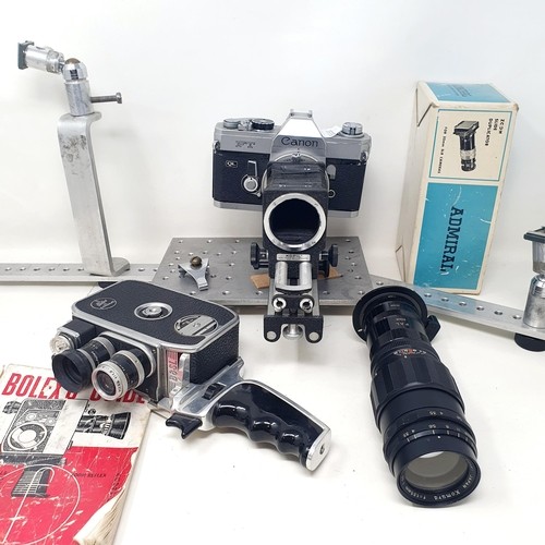 611 - A Graflex Speed Graphic bellows camera, with a Kodak lens, assorted photography equipment, a magic l... 