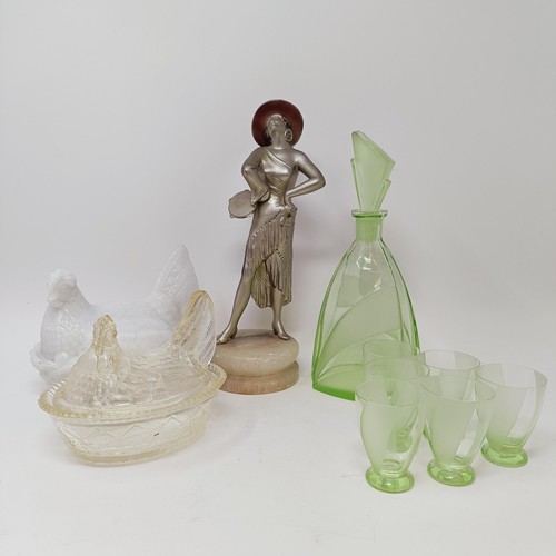 62 - An Art Deco spelter figure of a woman, on a white marble base, 29 cm high, a green glass decanter, s... 