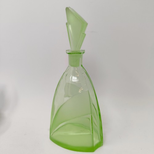 62 - An Art Deco spelter figure of a woman, on a white marble base, 29 cm high, a green glass decanter, s... 