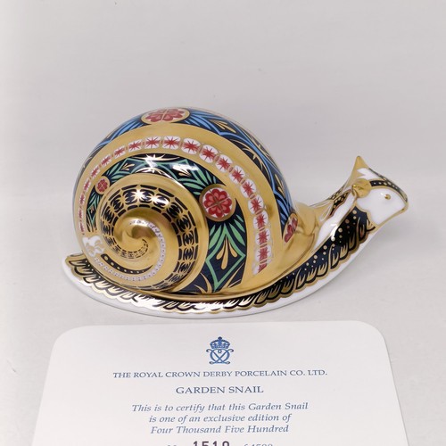 634 - A Royal Crown Derby limited edition paperweight, Garden Snail, 1510/4500, 7 cm high, with a certific... 