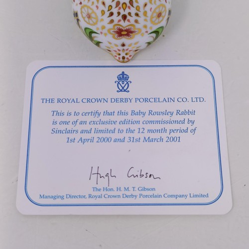 638 - A Royal Crown Derby limited edition paperweight, Millennium Dove, 725/1500, 15 cm wide, with a certi... 