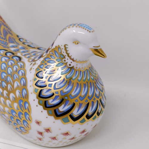 638 - A Royal Crown Derby limited edition paperweight, Millennium Dove, 725/1500, 15 cm wide, with a certi... 