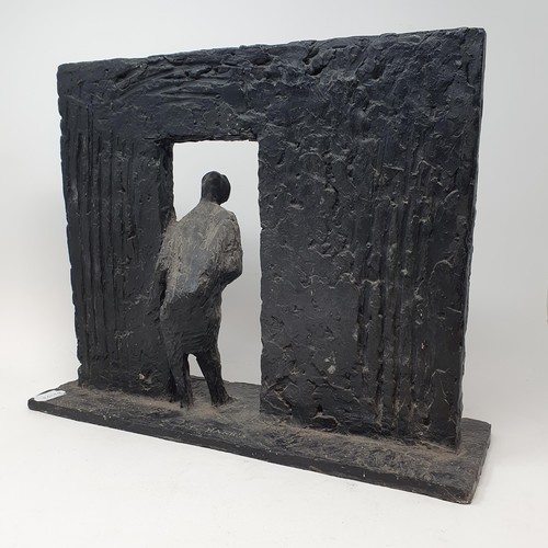 301 - G Harris, a figure of a man in a doorway, resin, signed, 33 x 41 cm