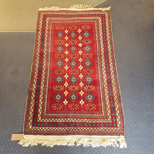 826 - A Kasak red ground rug, 170 x 100 cm