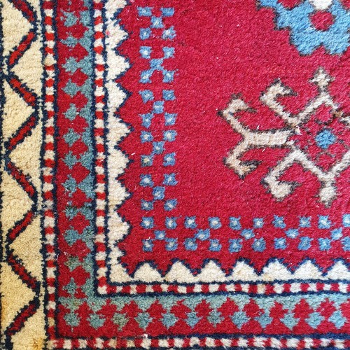 826 - A Kasak red ground rug, 170 x 100 cm