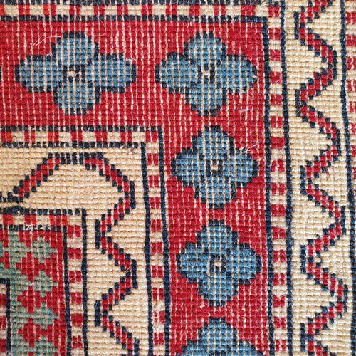 826 - A Kasak red ground rug, 170 x 100 cm