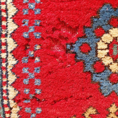 826 - A Kasak red ground rug, 170 x 100 cm