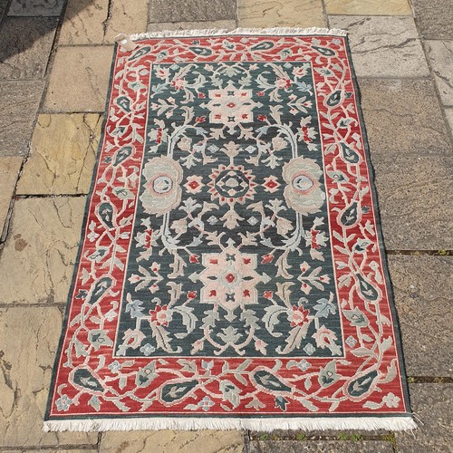 841 - A William Morris style green ground rug, 178 x 155 cm