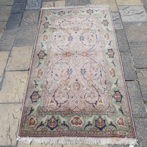 842 - A Polynesian cream ground rug, 220 x 120 cm