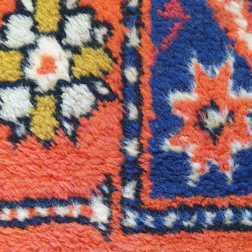 848 - A Kazak red ground rug, 216 x 134 cm