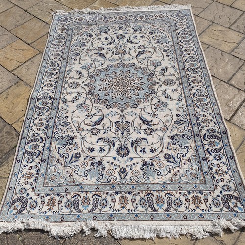 854 - A Persian Nain cream ground carpet, 295 x 200 cm