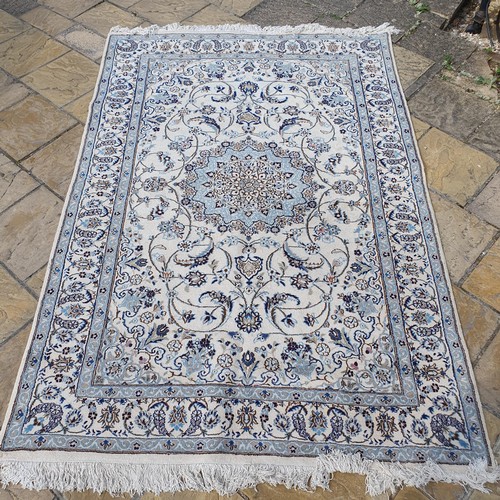 854 - A Persian Nain cream ground carpet, 295 x 200 cm