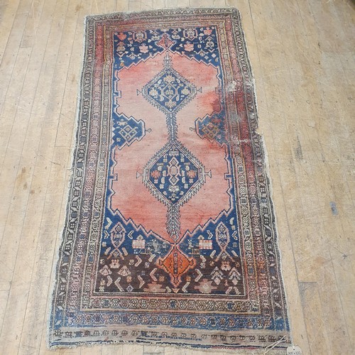 856 - A Persian type red ground rug, 205 x 100 cm