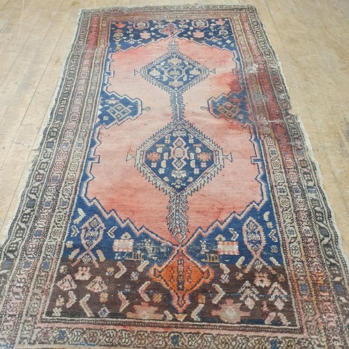 856 - A Persian type red ground rug, 205 x 100 cm