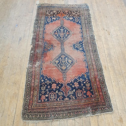 856 - A Persian type red ground rug, 205 x 100 cm