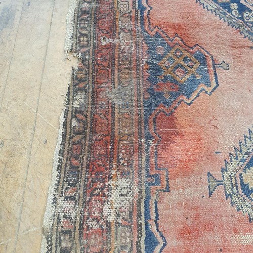 856 - A Persian type red ground rug, 205 x 100 cm