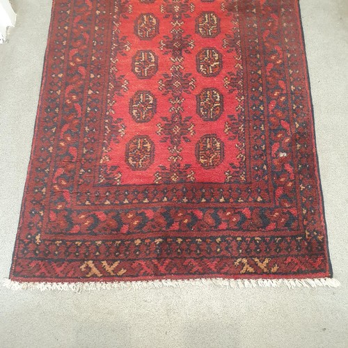 860 - An Afghan type red ground runner, 395 x 79 cm