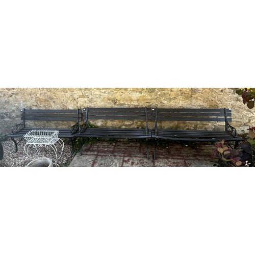 951 - A set of four painted metal and wooden benches, 120 cm wide (4)