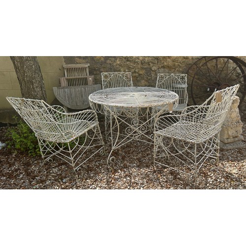 954 - A set of four wirework garden armchairs, and a table (5)