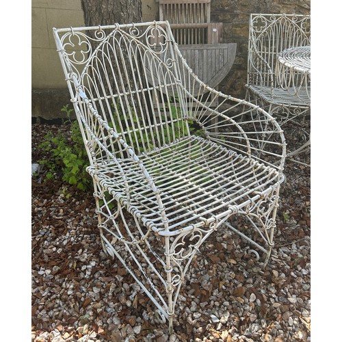 954 - A set of four wirework garden armchairs, and a table (5)