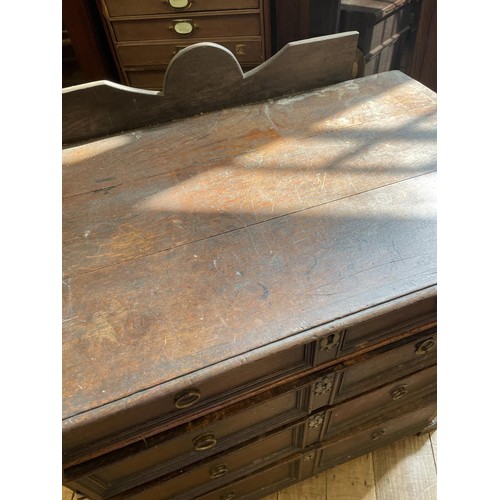 759 - An 18th century oak chest, having four drawers, 93 cm wide