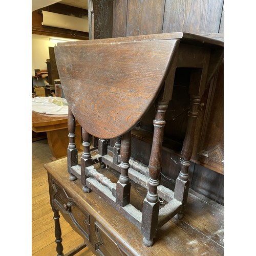 755 - An oak dresser, 103 cm wide, a wine table, a drop leaf table, three chairs, a kitchen table, and a c... 