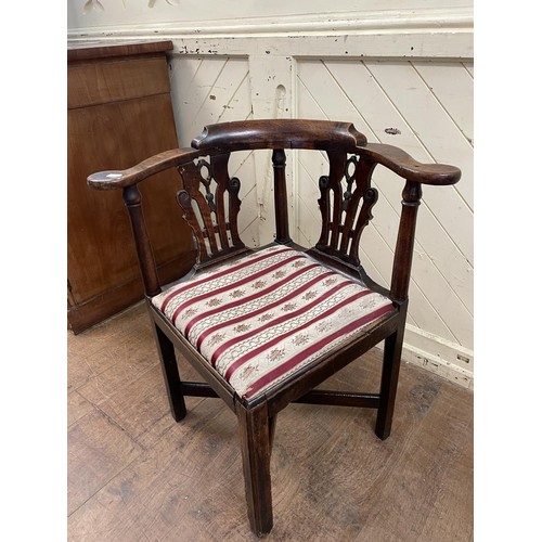 769 - A 19th century corner chair, with a pierced splat back, drop in seat and square legs