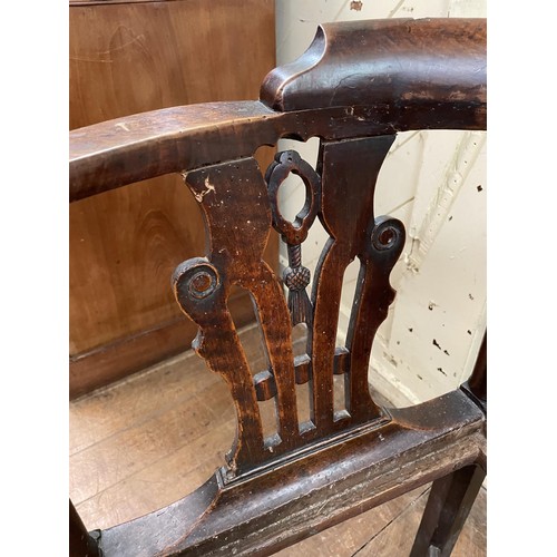 769 - A 19th century corner chair, with a pierced splat back, drop in seat and square legs